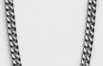 Close-up of satin steel curb chain links